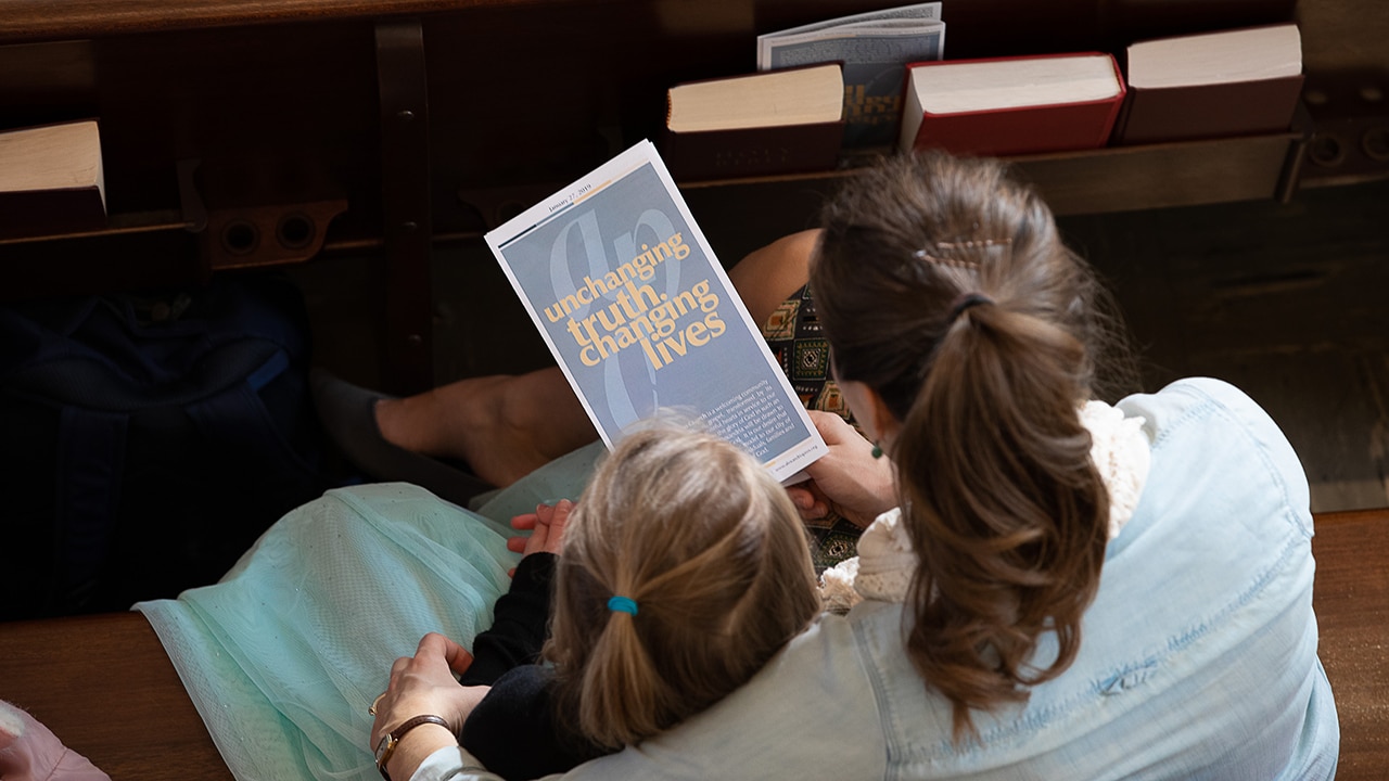 Unchanging Truth family in pew
